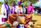 Archbishop of York commissions Hannington sanctuary in Busia, Uganda:<br />L-R: Tororo Catholic Diocese Bishop Emmanuel Obbo, Bukedi Diocese Bishop Simon Bogere Egesa, Archbishop of York John Sentamu, chairperson of the Uganda Judicial Commission Justice James Ogoola and former Bishop of Bukedi Diocese Nikodemus Okille pose in front of a tree in Budimo village, Busia District, where the remains of the bishop were kept for four days during 1888.<br />Photo by Dominic Bukenya.