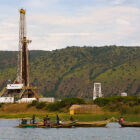 The Uganda countryside oil rig pumps alongside the fresh lake of Kyoga, Western Uganda: